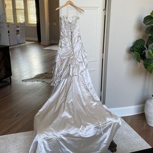 Wedding dress.  Silk, a-line with asymmetrical rouging around waist and hips.